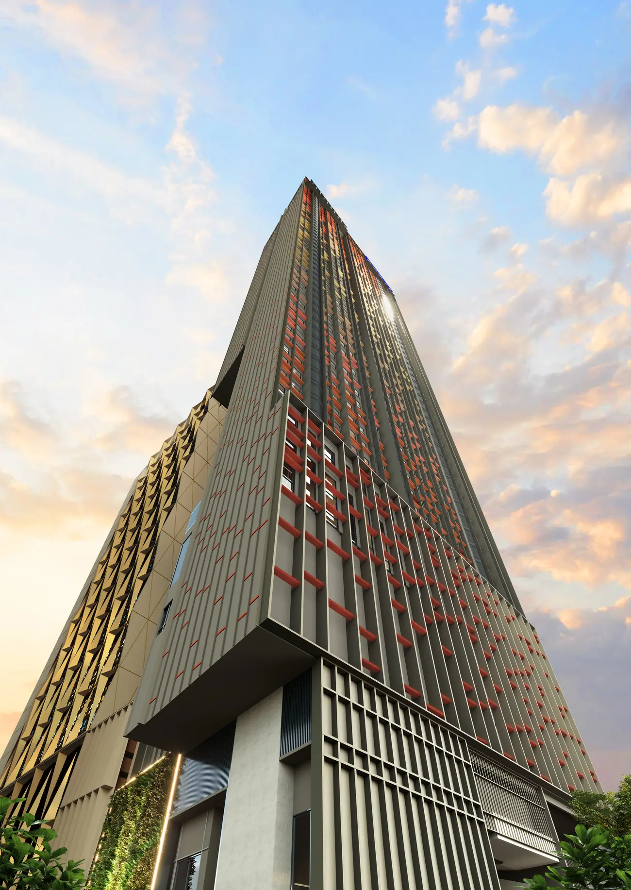 Phoeniz Suites tower facade at dusk, gold and red fins against the KL sky