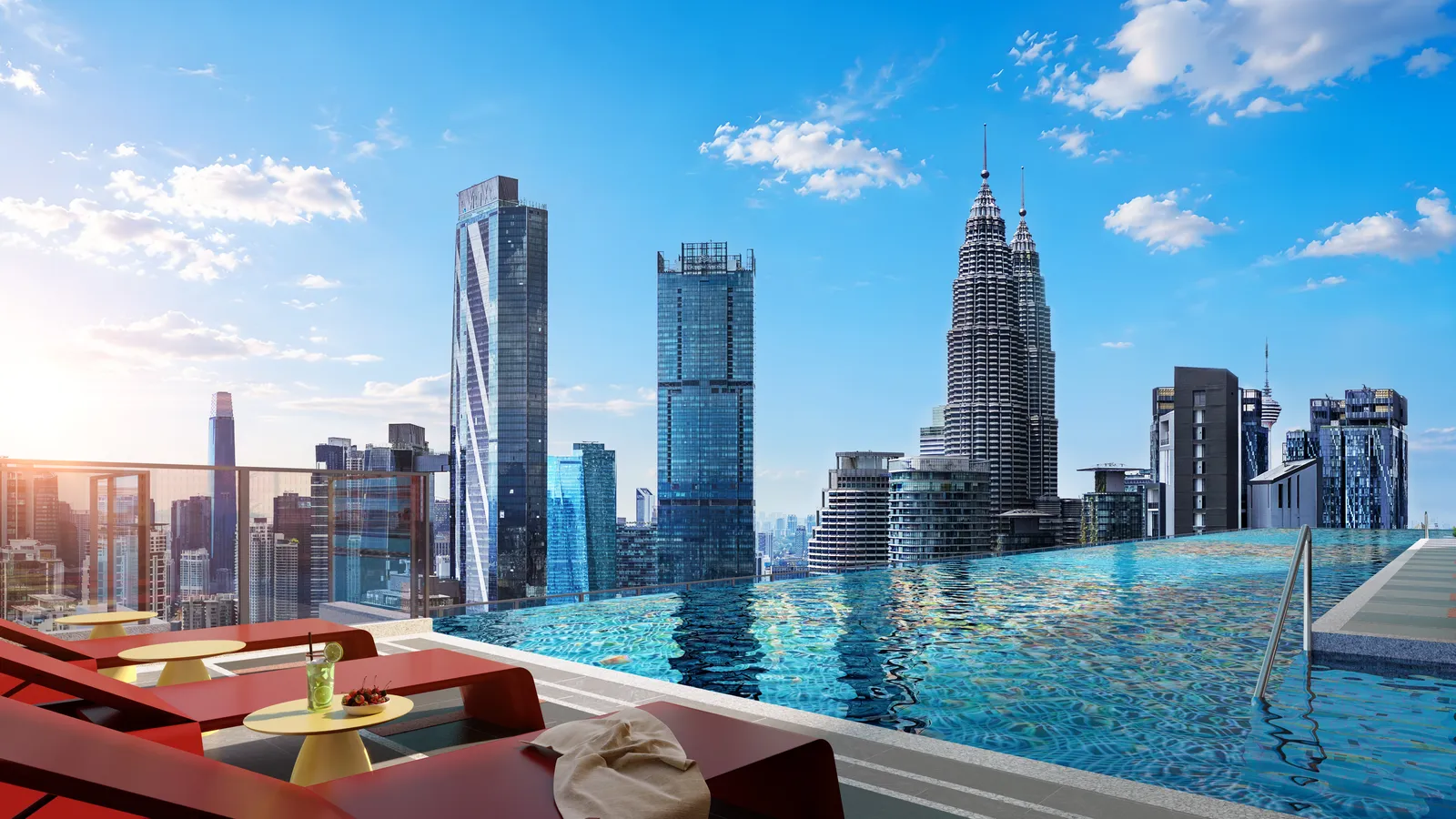 Sky infinity pool at Phoeniz Suites by day, facing the Petronas Twin Towers and KL City Centre skyline